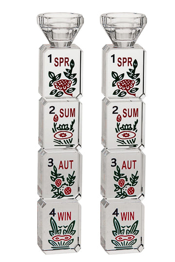 Pair of crystal candlesticks stacked with Mahjongg season tiles marked SPR, SUM, AUT and WIN