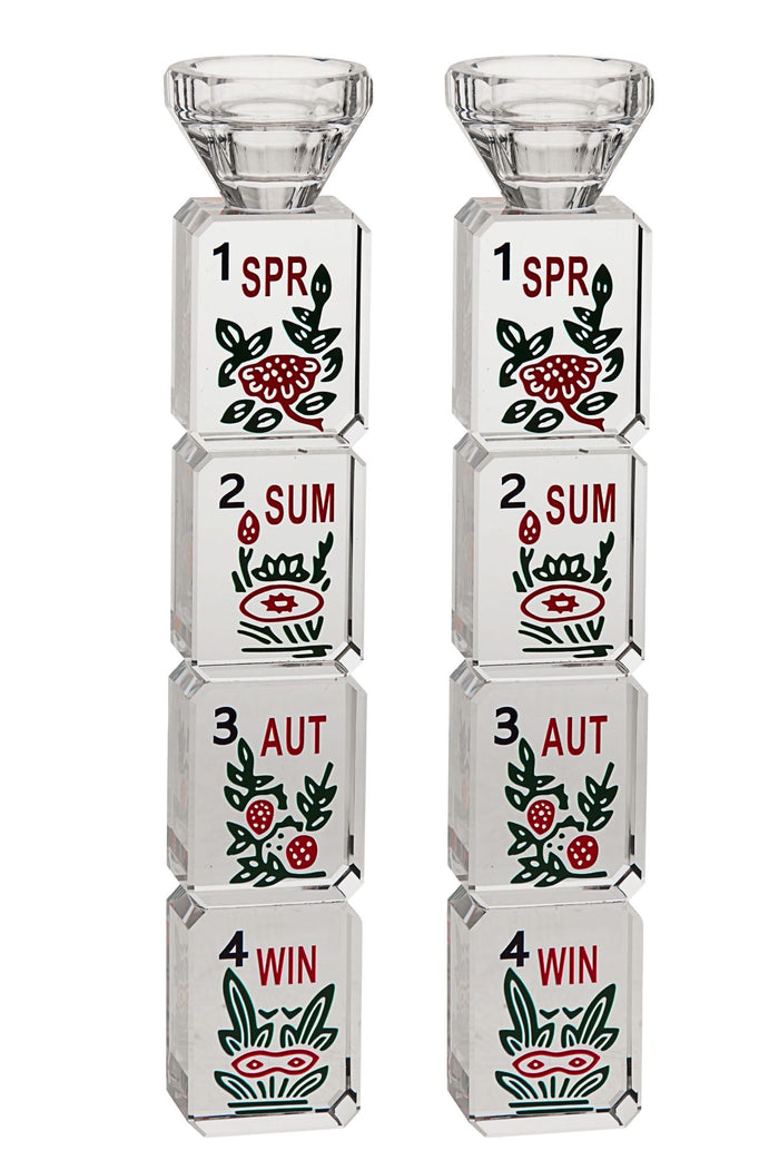 Pair of crystal candlesticks stacked with Mahjongg season tiles marked SPR, SUM, AUT and WIN