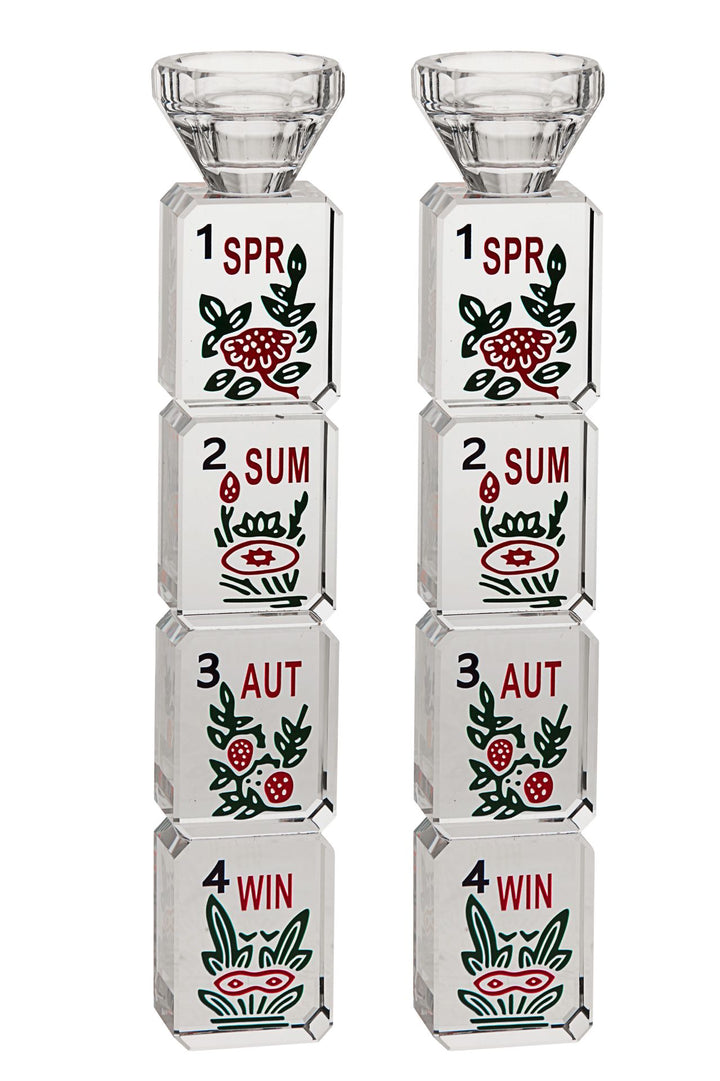 Pair of crystal candlesticks stacked with Mahjongg season tiles marked SPR, SUM, AUT and WIN
