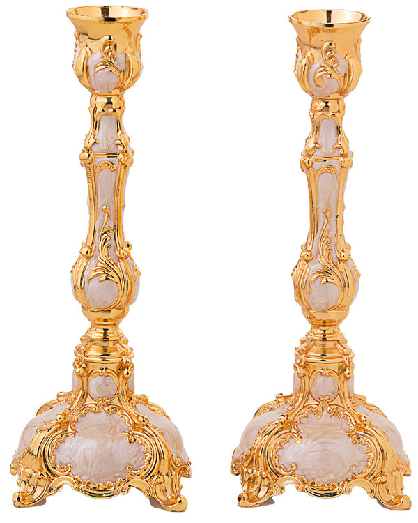 Gold enamel candlestick on a footed square base with a single candle cup