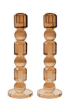 Tall gold toned crystal candlestick column standing on a wide square base
