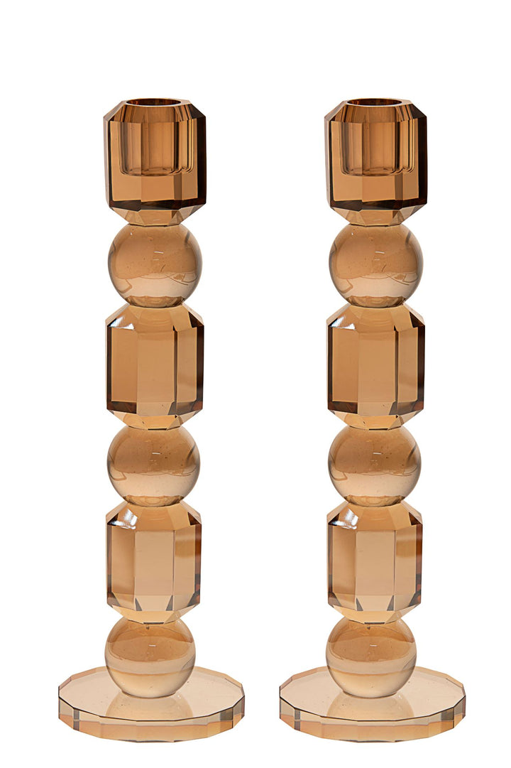 Pair of gold-tinted crystal candlesticks built from stacked faceted blocks and spheres