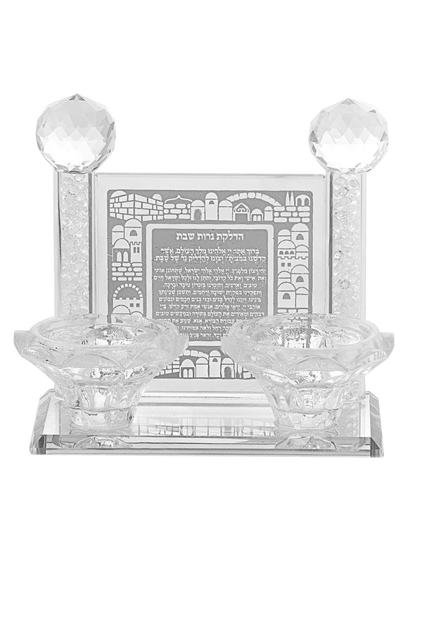 Two lotus cut crystal tealight cups in front of a clear etched panel showing the Jerusalem skyline