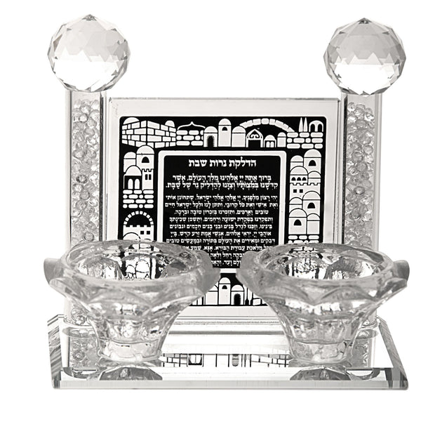 Crystal Shabbos candle set with two tealight cups before a black panel printed with the candle lighting brachah
