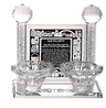 Crystal Shabbos candle set with two tealight cups before a black panel printed with the candle lighting brachah
