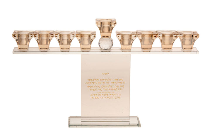 Crystal Chanukah menorah with nine gold tone cups on a straight bar above an upright panel of Hebrew brachos