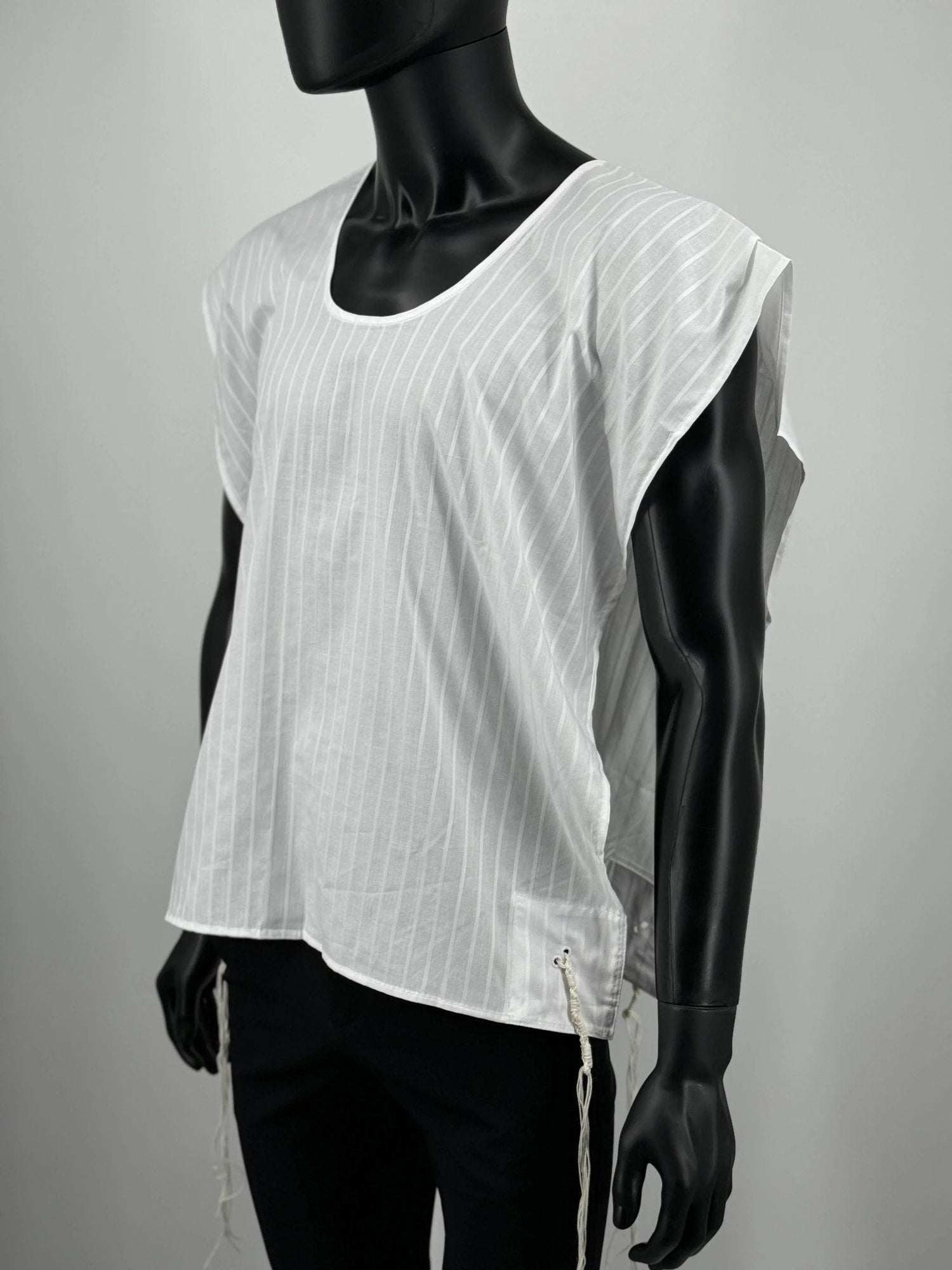 White sleeveless tzitzit undershirt with subtle pattern on mannequin