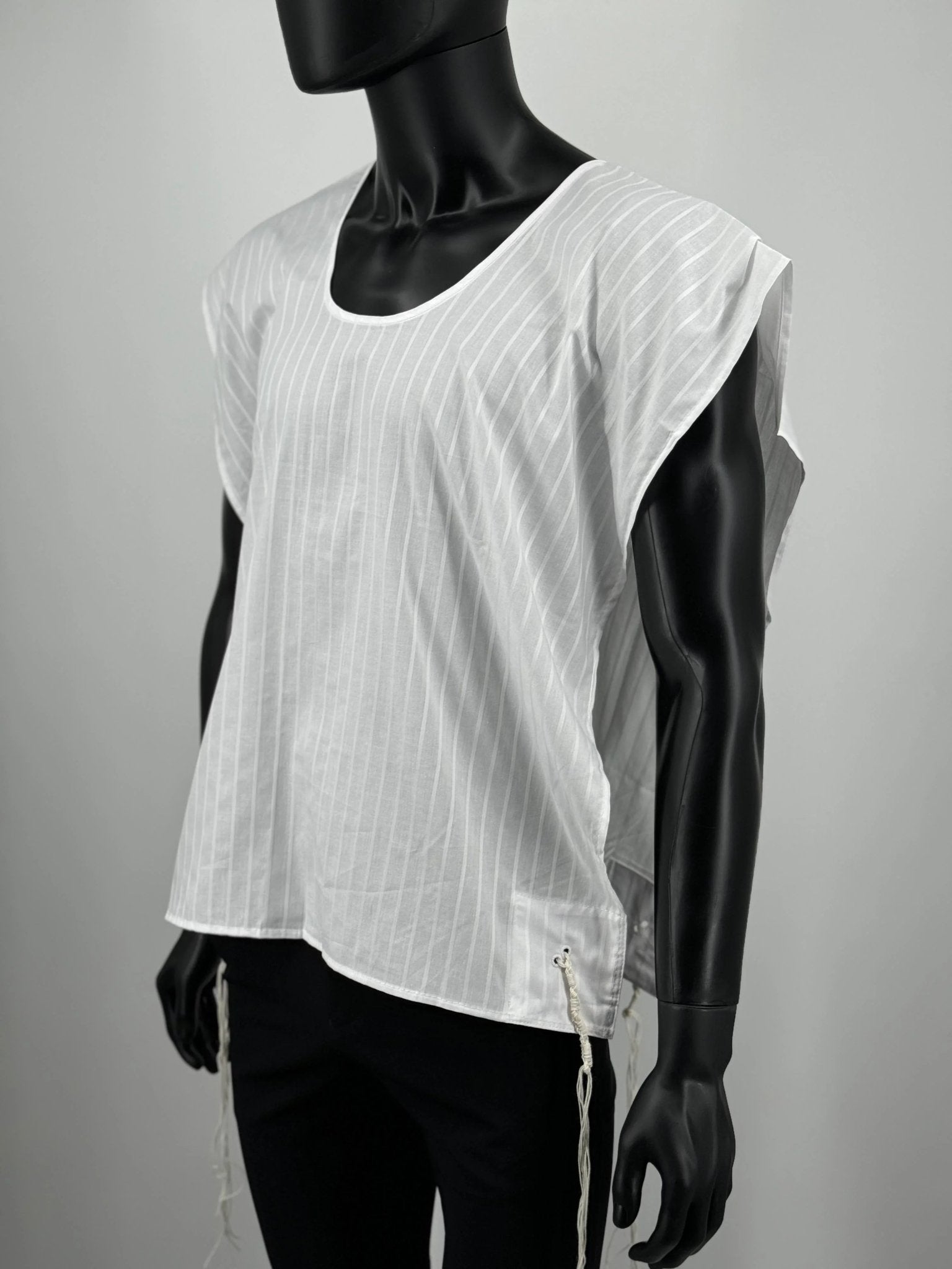 White sleeveless tzitzit undershirt with subtle pattern on mannequin