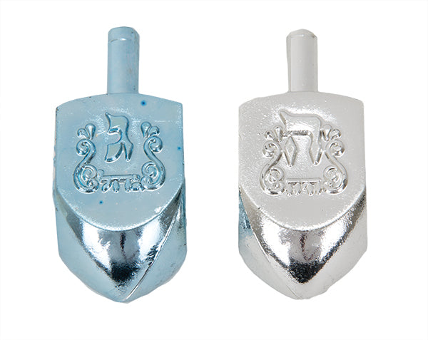 Metallic Blue & Silver Dreidels — medium dreidels mid-spin in blue and silver chrome finish | Judaica Square Lakewood
