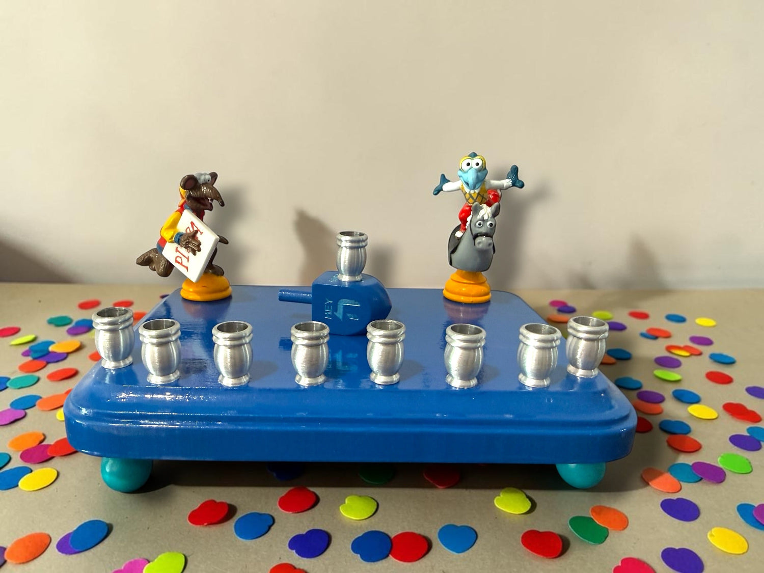 Gonzo and Ralph menorah — two Muppets chess figures sharing a painted wood plaque | Judaica Square Lakewood (view 4)