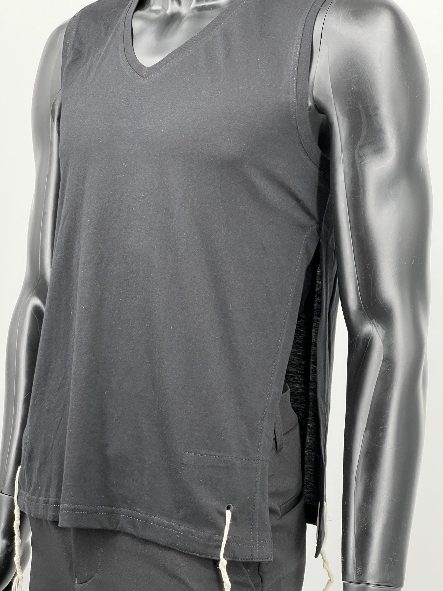 Black sleeveless cotton tzitzit tank top side view with strings