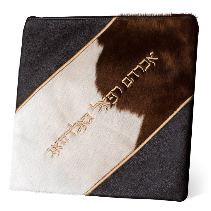 Design 343 tallis bag with a brown-and-white fur panel, dark corners and a sample Hebrew name