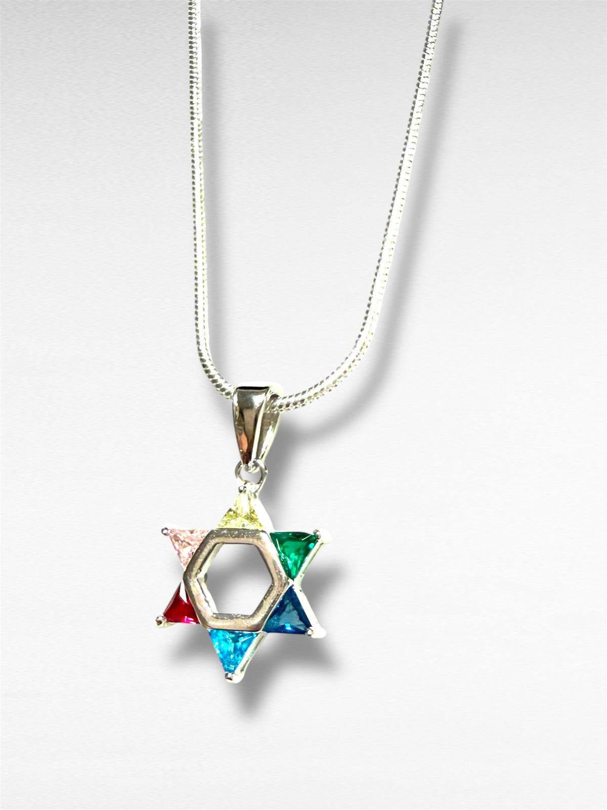 Petite sterling Star of David pendant set with rainbow gemstones