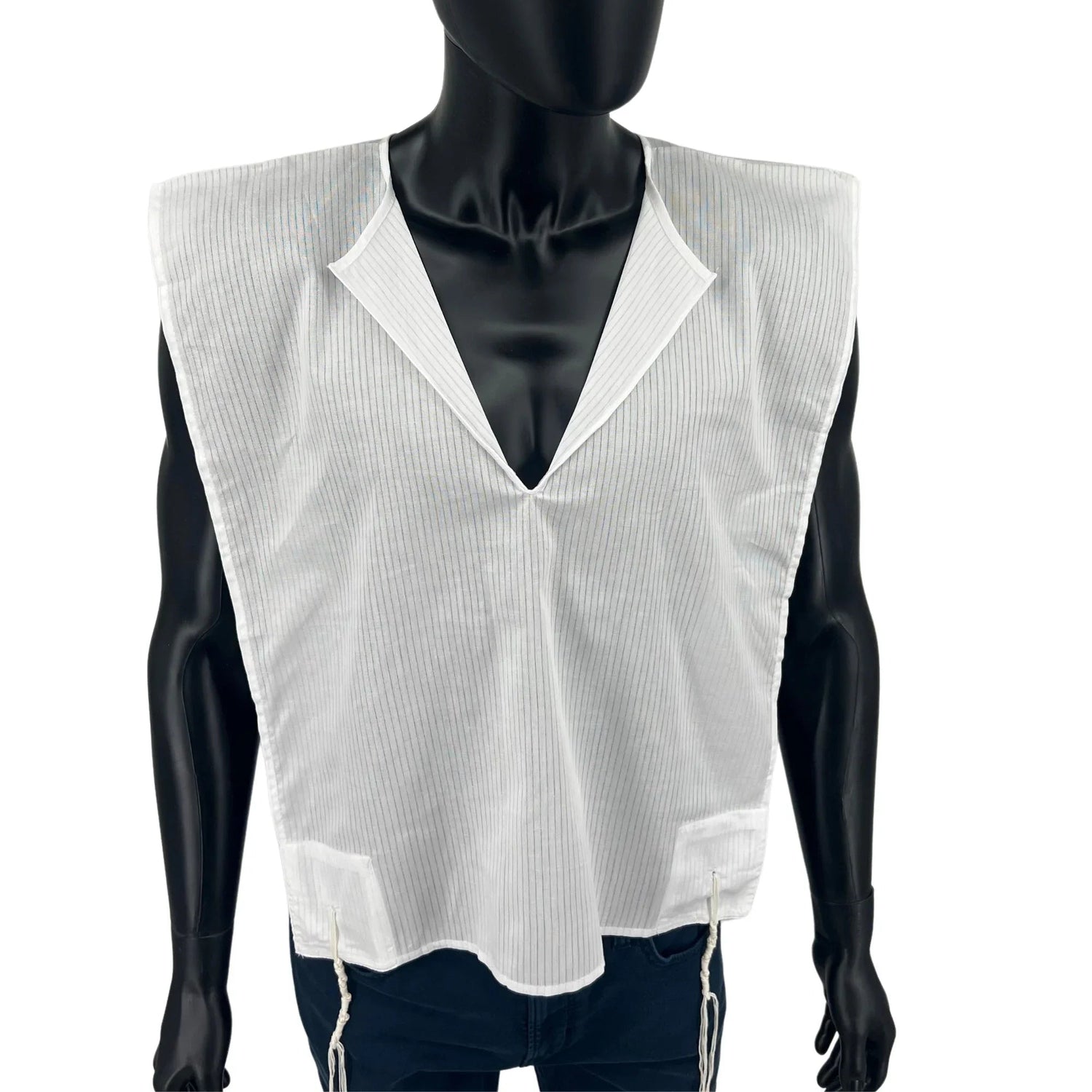 Men's cotton tallit katan V-neck and front tzitzit strings close-up