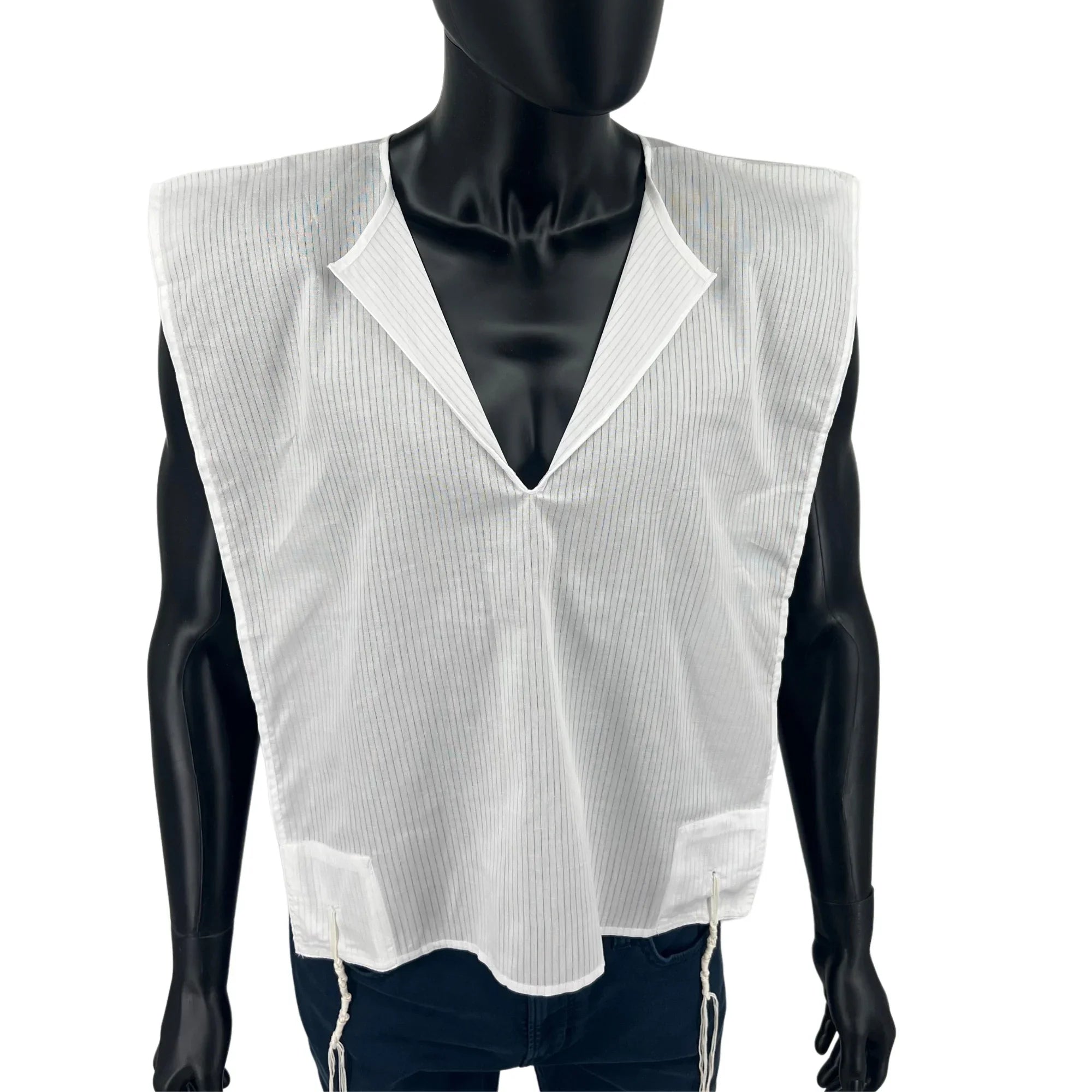 Men's cotton tallit katan V-neck and front tzitzit strings close-up