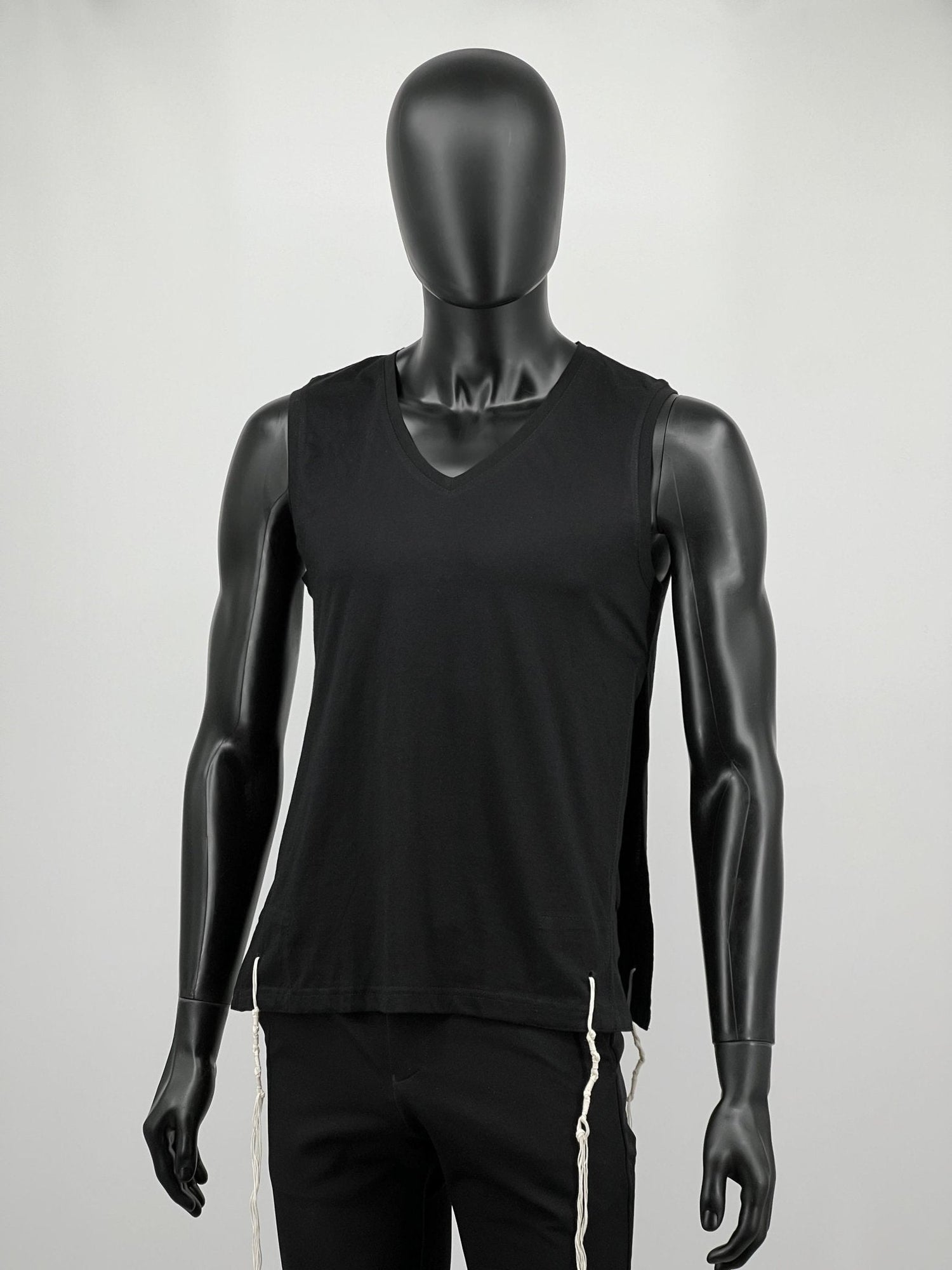 Black sleeveless cotton tzitzit tank top on mannequin, full view