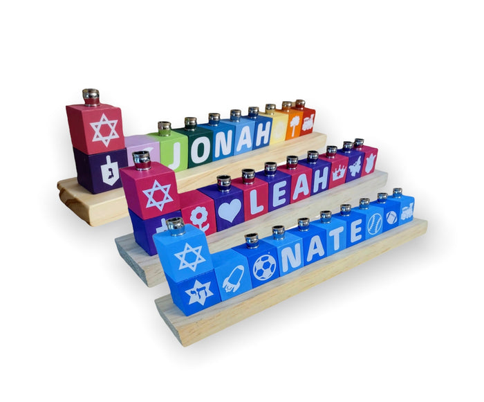 Three personalized wooden name-block menorah examples in different color palettes