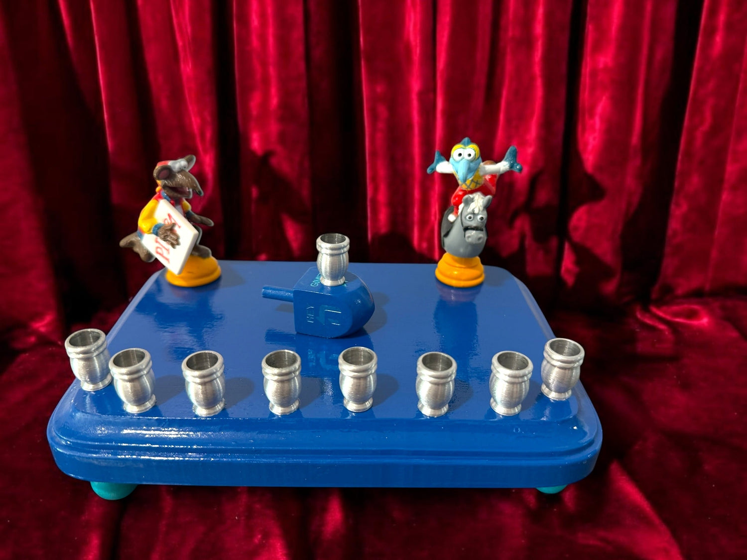 Gonzo and Ralph menorah — two Muppets chess figures sharing a painted wood plaque | Judaica Square Lakewood (view 6)