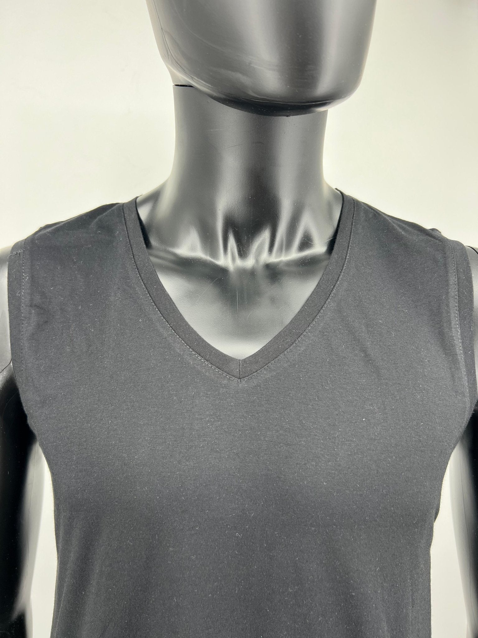 Black sleeveless cotton tzitzit tank top V-neck close-up