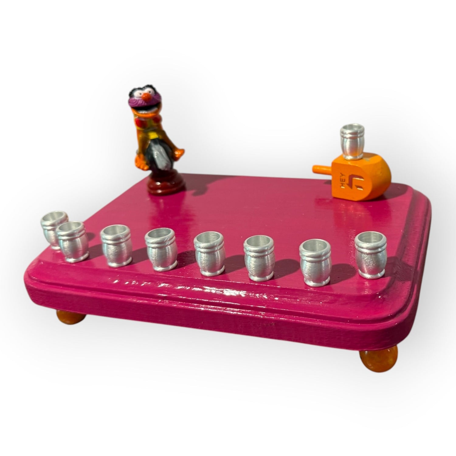 Animal Muppets menorah — wild-haired drummer chess figure above aluminum candle cups | Judaica Square Lakewood (view 3)