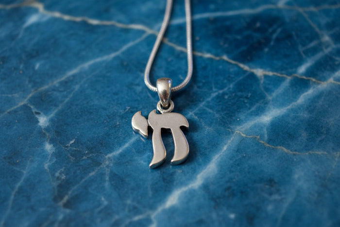 Sterling silver chai necklace — Hebrew life pendant on snake chain | Judaica Square Lakewood