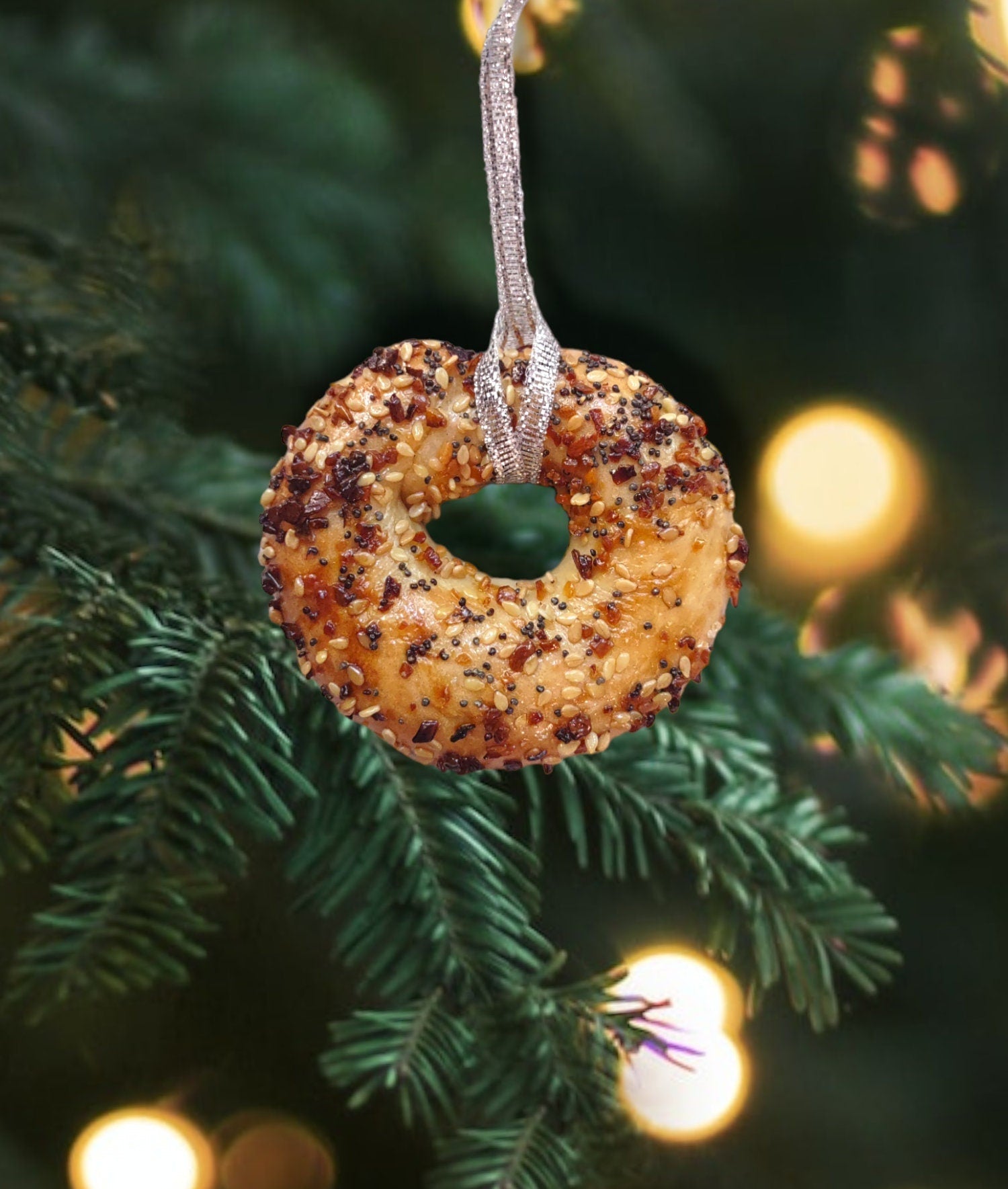 Real preserved everything bagel ornament hanging from a ribbon loop | Judaica Square Lakewood (view 2)