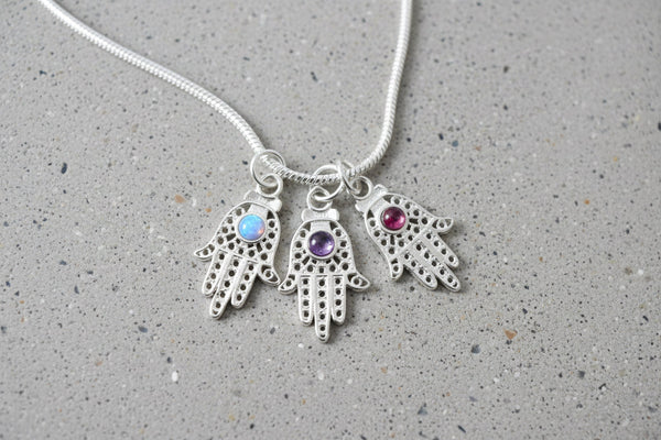 Filigree sterling hamsa pendant set with a purple amethyst stone | Judaica Square Lakewood