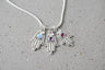 Filigree sterling hamsa pendant set with a purple amethyst stone | Judaica Square Lakewood