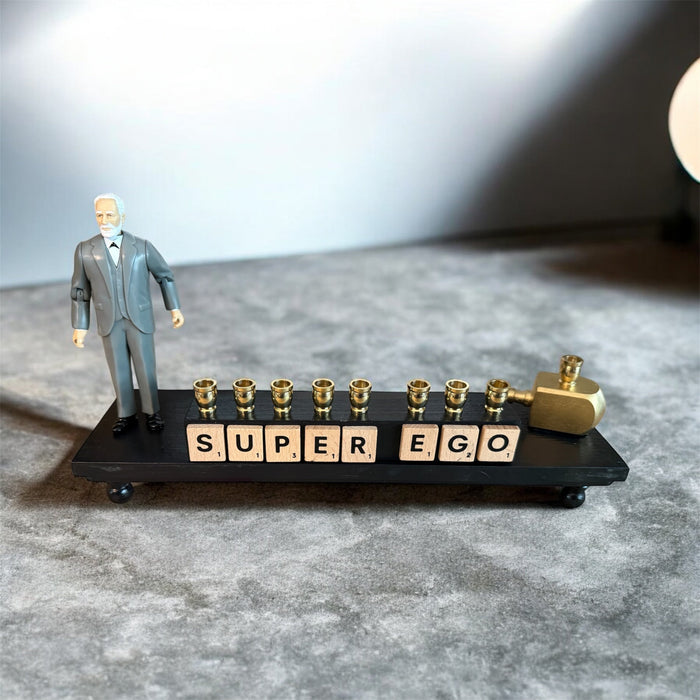 Sigmund Freud Menorah — Freud figure with SUPEREGO letter tiles and gold cups | Judaica Square Lakewood