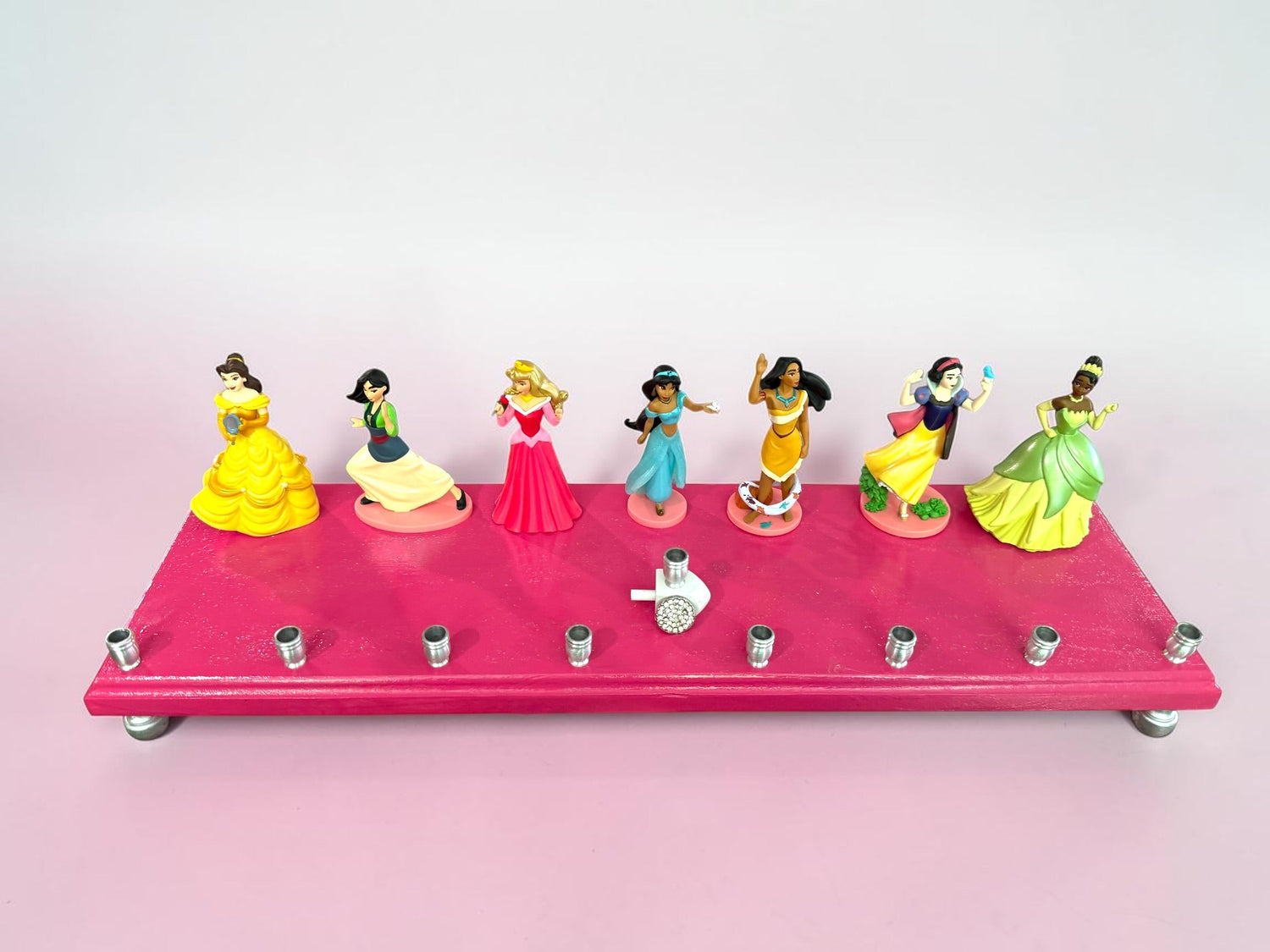 Classic Disney princess menorah — row of repurposed princess figures on pink glitter plaque | Judaica Square Lakewoo (view 6)