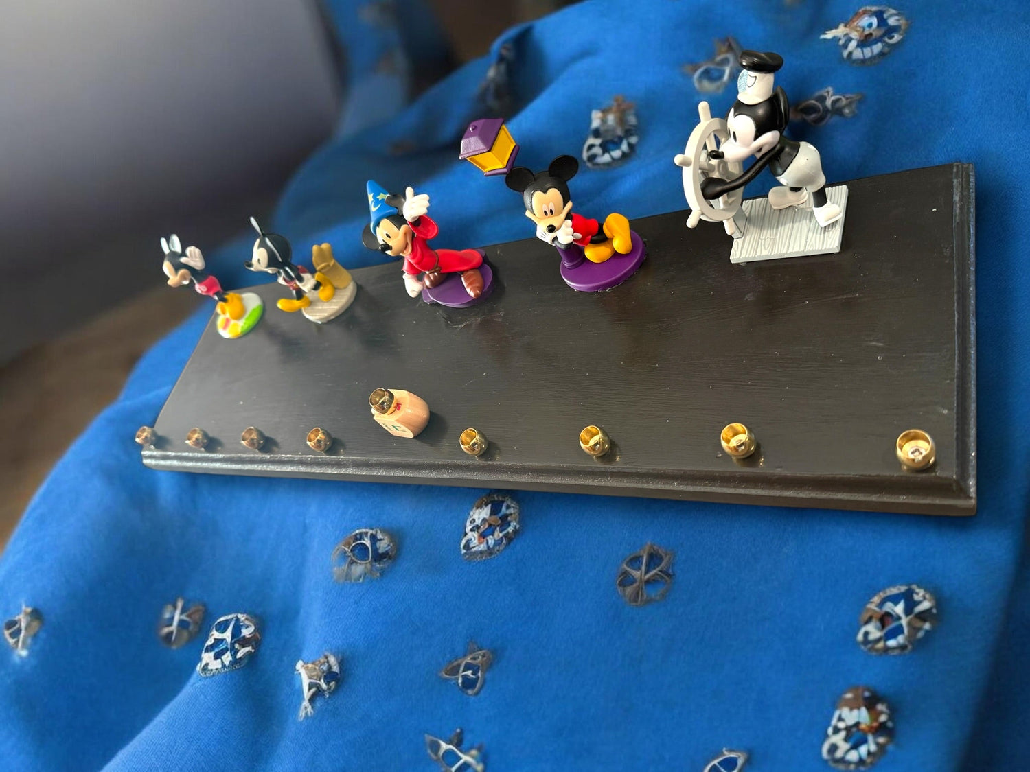 Mickey Mouse anniversary menorah — row of repurposed Disney figures with brass cups | Judaica Square Lakewood (view 2)