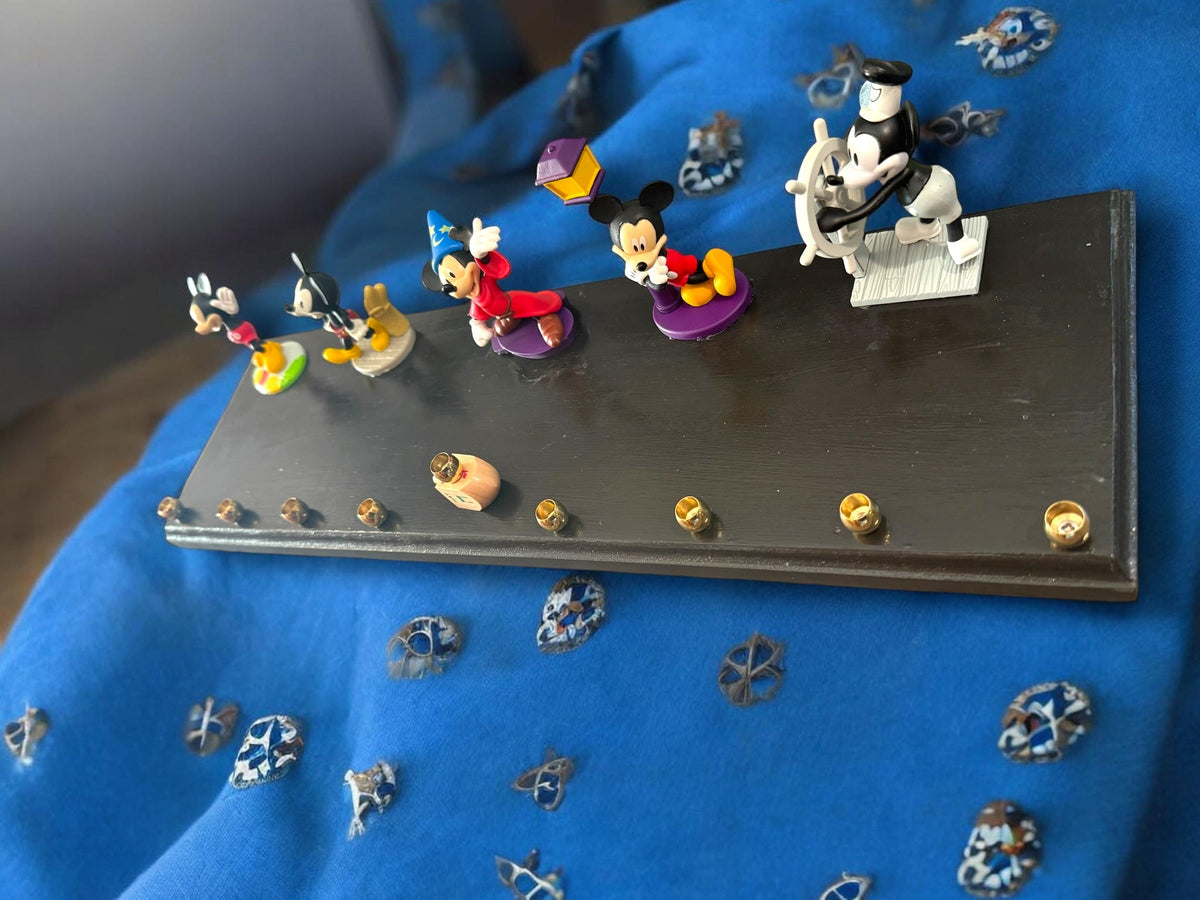 Mickey Mouse anniversary menorah — row of repurposed Disney figures with brass cups | Judaica Square Lakewood (view 2)