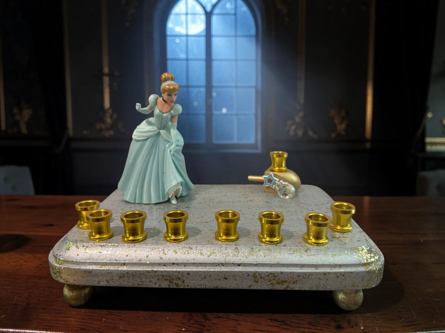 Cinderella menorah — Disney princess figurine on silver base with nine gold cups | Judaica Square Lakewood (view 2)