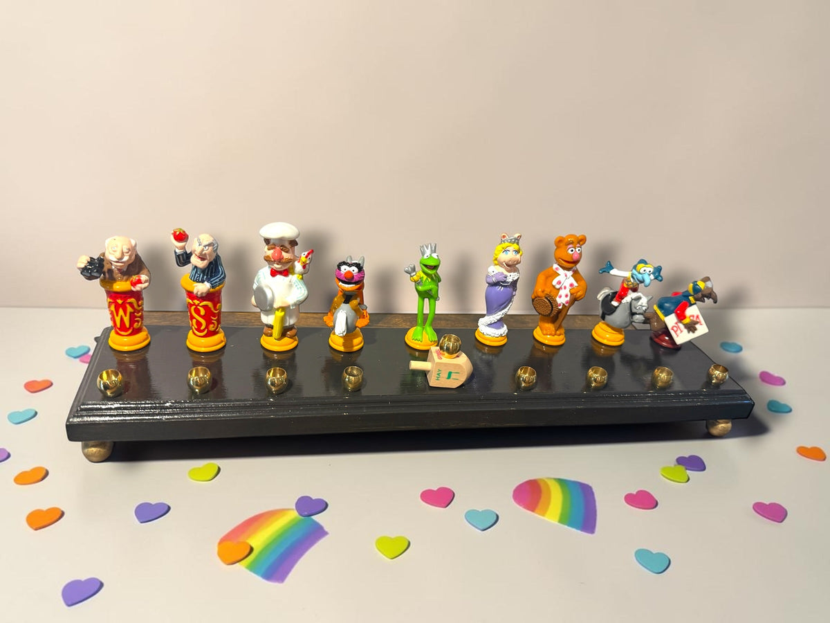 Larger Muppets collector menorah with repurposed character figures, alternate view