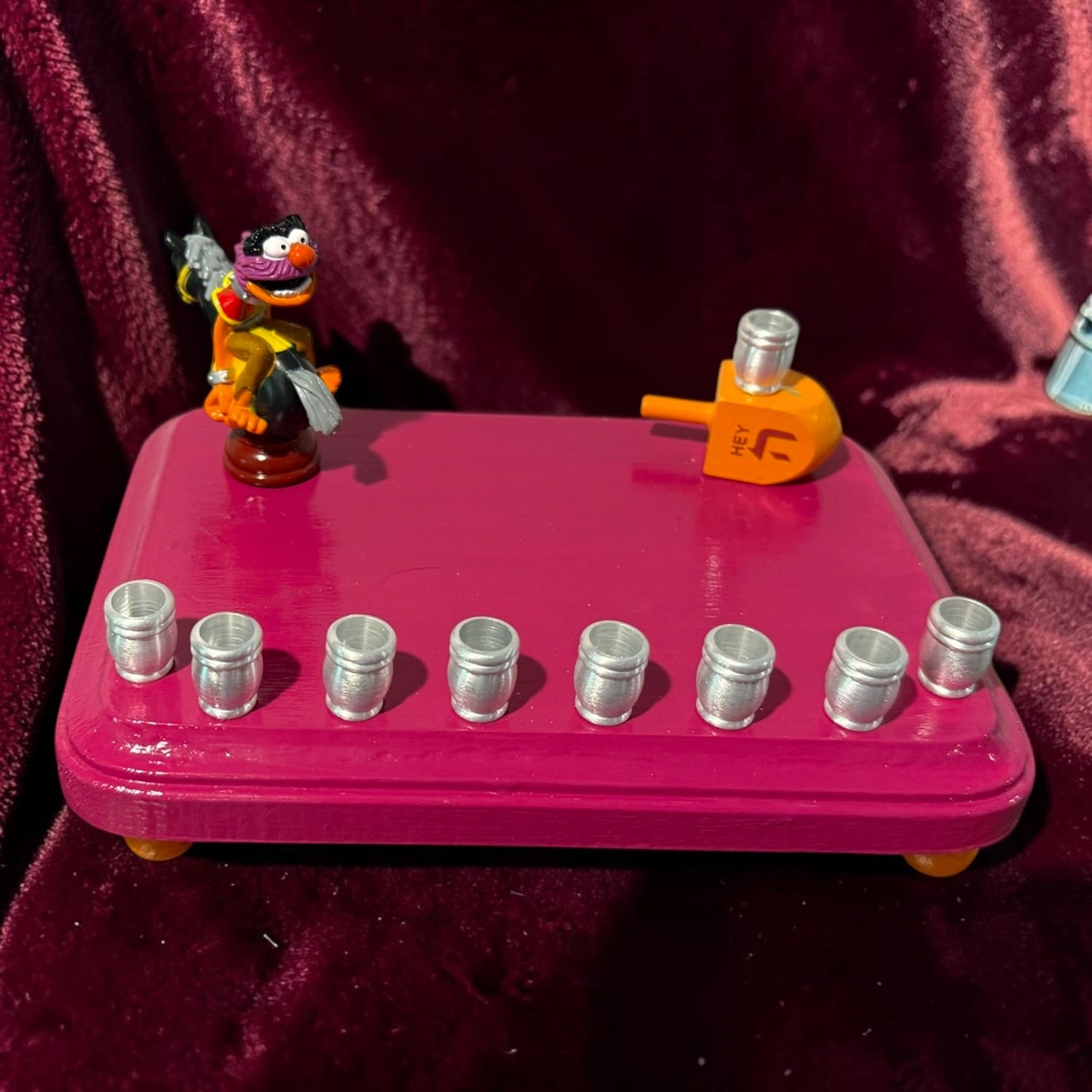 Animal Muppets menorah — wild-haired drummer chess figure above aluminum candle cups | Judaica Square Lakewood (view 11)