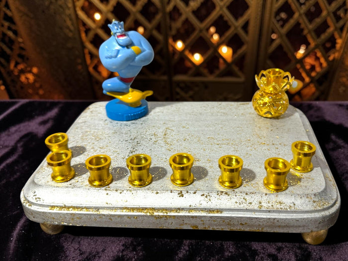 Genie menorah — blue Aladdin genie figure on painted wood plaque with aluminum candle cups | Judaica Square Lakewood