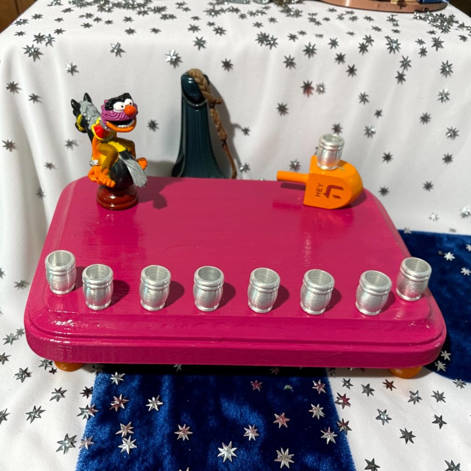 Animal Muppets menorah — wild-haired drummer chess figure above aluminum candle cups | Judaica Square Lakewood (view 8)