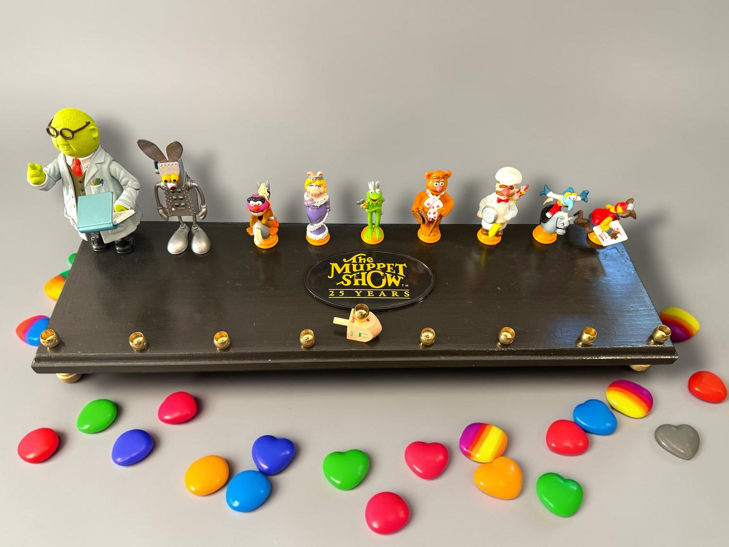 Muppets cast menorah — nine repurposed Muppets figures along a long plaque with brass cups | Judaica Square Lakewoo (view 19)