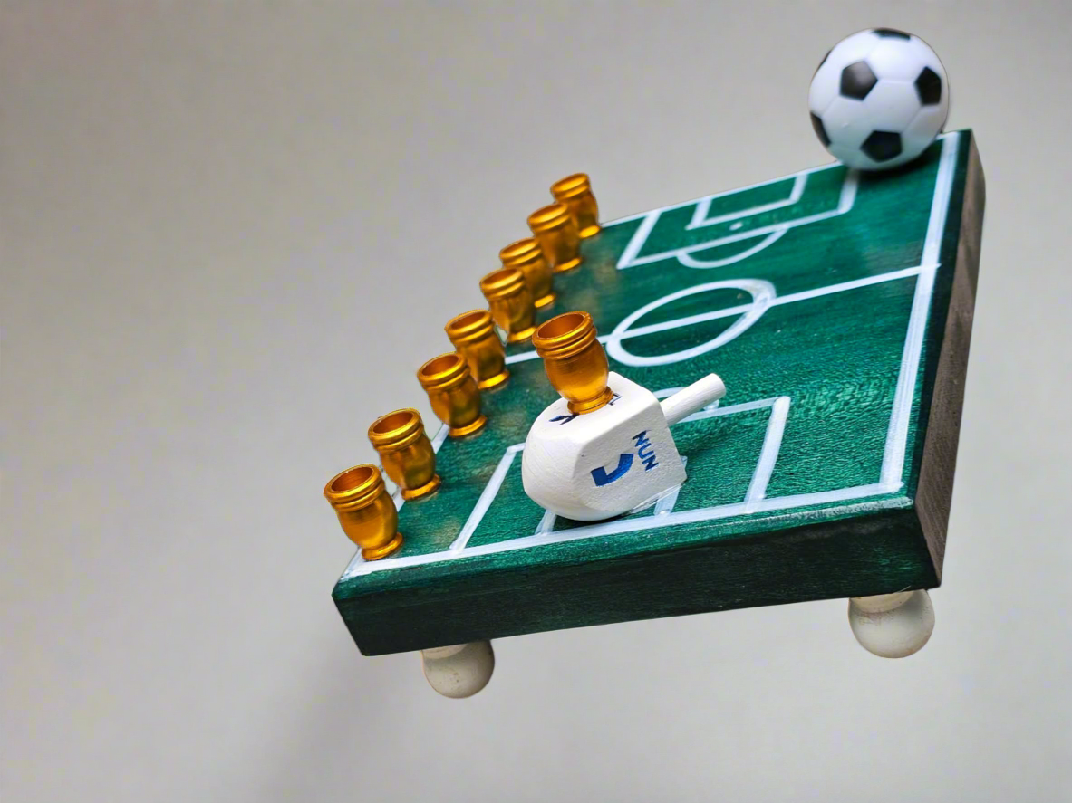 Soccer Menorah — repurposed player figure with wood dreidel and aluminum cups | Judaica Square Lakewood (view 2)