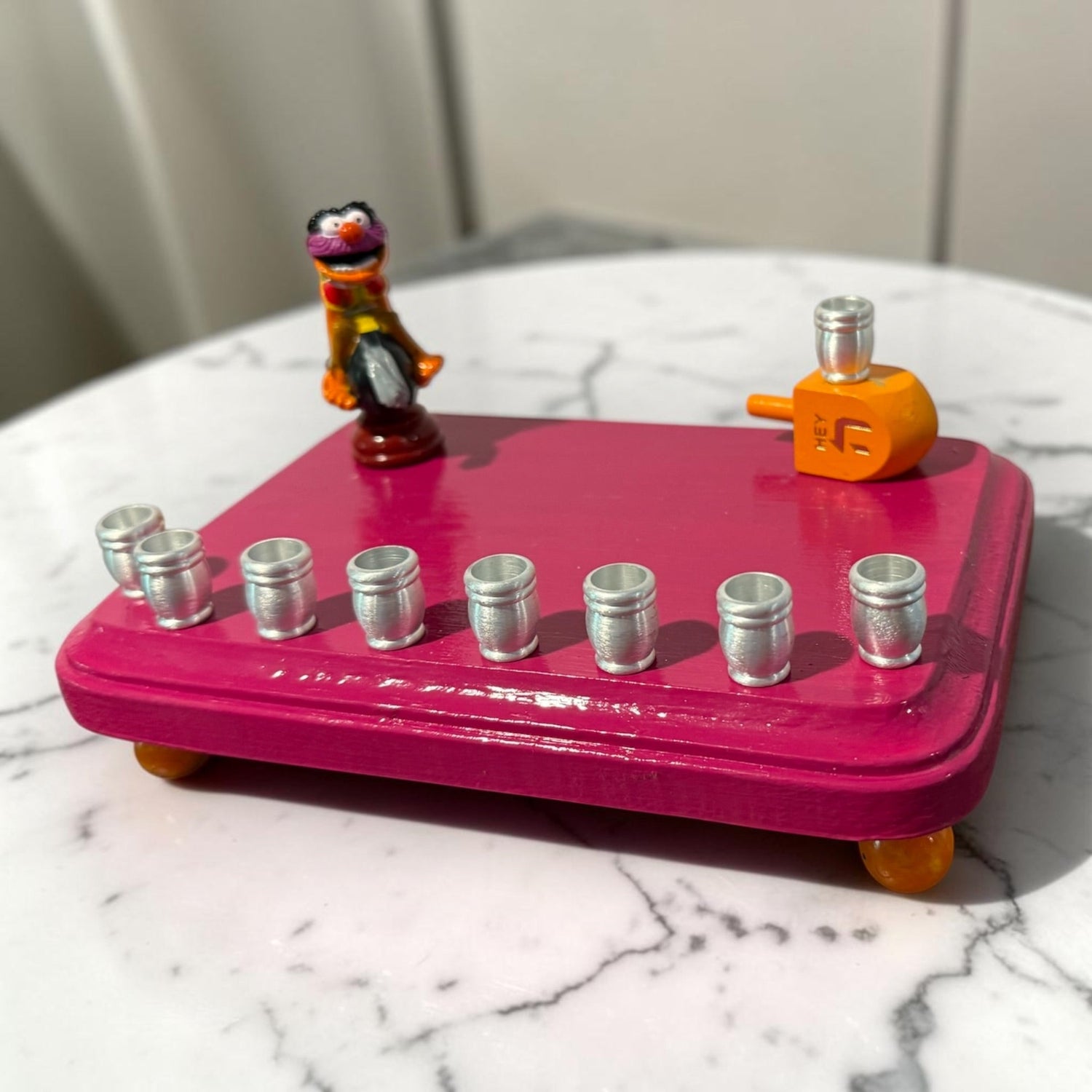 Animal Muppets menorah — wild-haired drummer chess figure above aluminum candle cups | Judaica Square Lakewood (view 7)