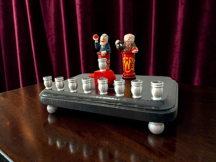 Statler and Waldorf menorah — two old Muppets hecklers over aluminum candle cups | Judaica Square Lakewood