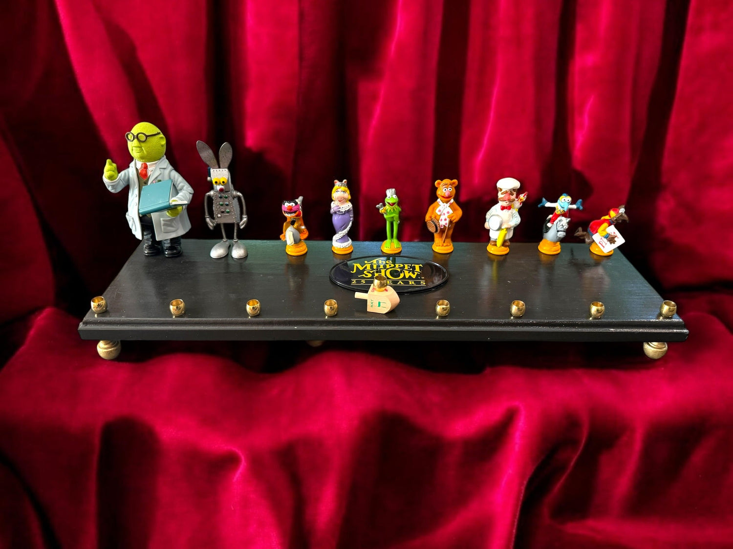 Muppets cast menorah — nine repurposed Muppets figures along a long plaque with brass cups | Judaica Square Lakewood (view 2)