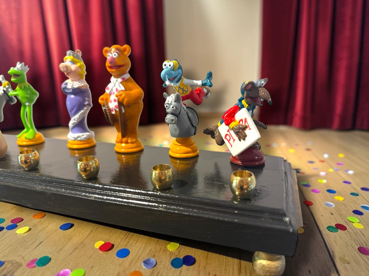 Larger Muppets collector menorah with repurposed character figures, alternate view