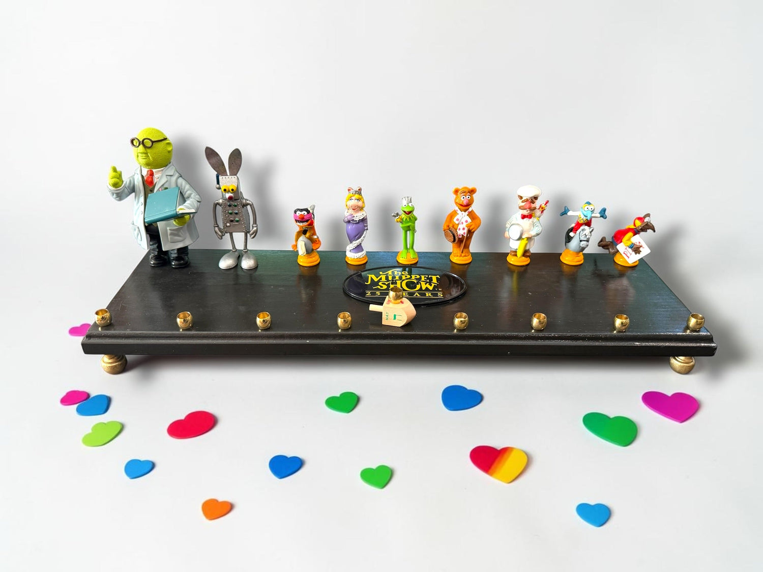 Muppets cast menorah — nine repurposed Muppets figures along a long plaque with brass cups | Judaica Square Lakewoo (view 18)