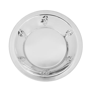 Small round stainless steel tray with embossed grape clusters around the rim, top view