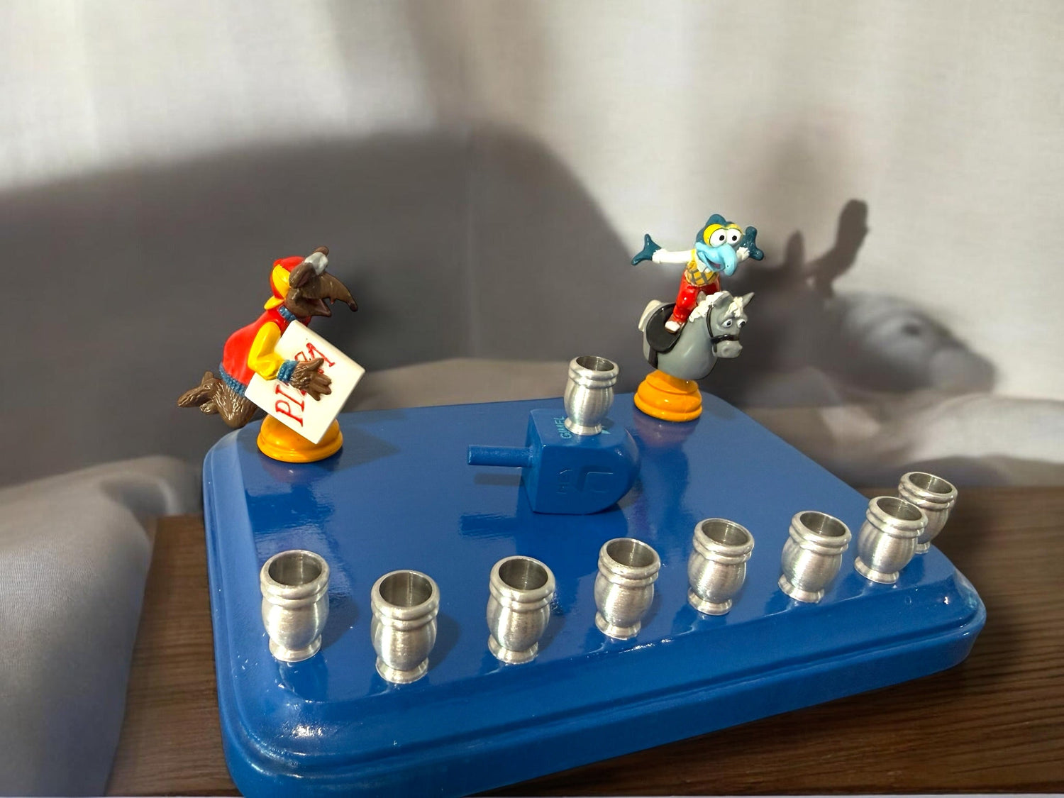 Gonzo and Ralph menorah — two Muppets chess figures sharing a painted wood plaque | Judaica Square Lakewood (view 9)