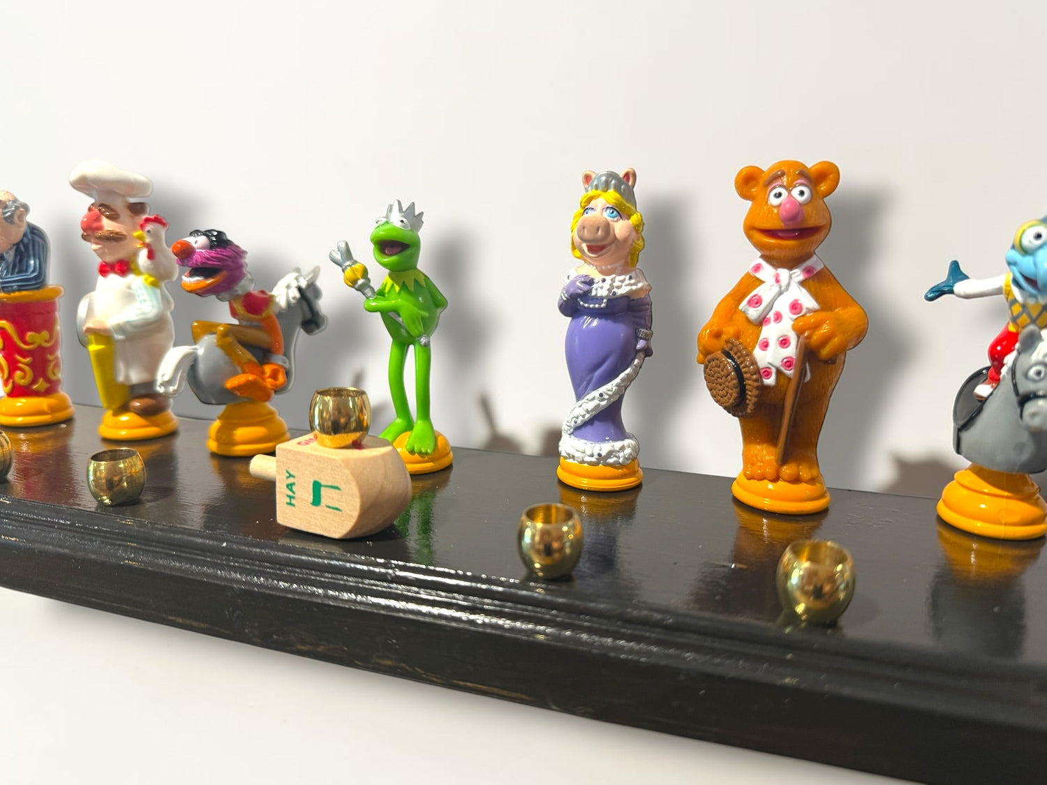 Muppets cast menorah — nine repurposed Muppets figures along a long plaque with brass cups | Judaica Square Lakewoo (view 15)