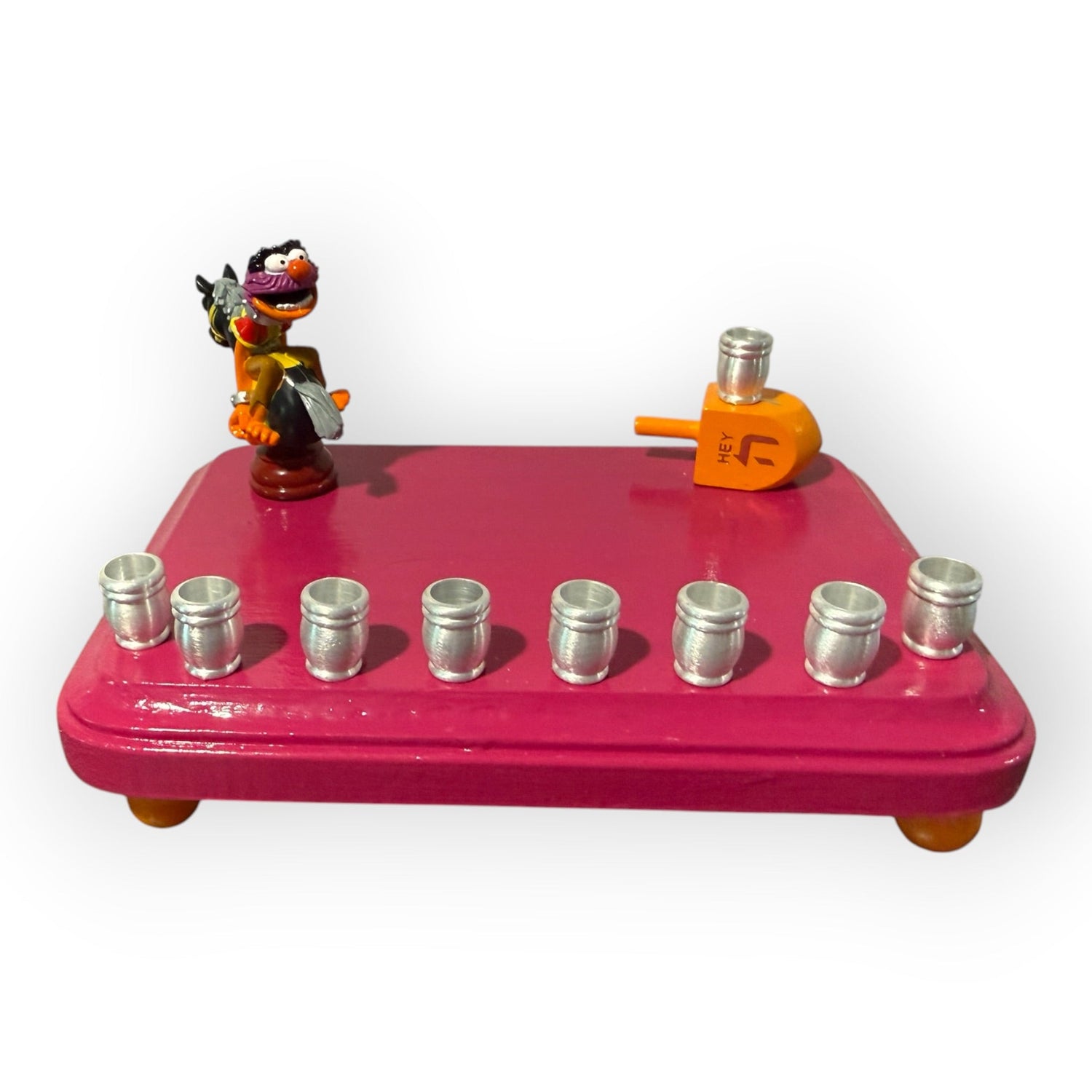 Animal Muppets menorah — wild-haired drummer chess figure above aluminum candle cups | Judaica Square Lakewood (view 4)