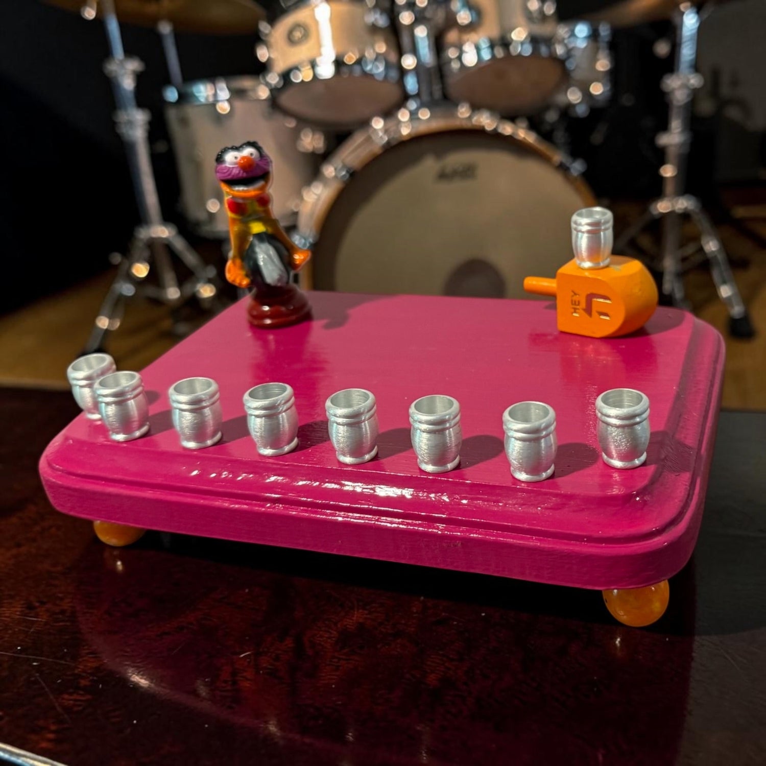 Animal Muppets menorah — wild-haired drummer chess figure above aluminum candle cups | Judaica Square Lakewood (view 10)