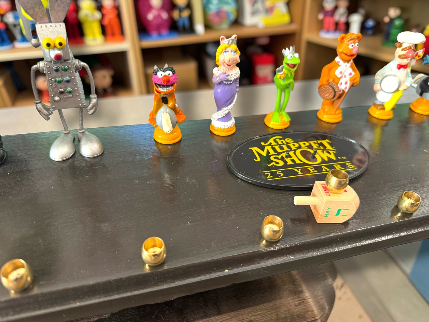 Muppets cast menorah — nine repurposed Muppets figures along a long plaque with brass cups | Judaica Square Lakewood (view 9)